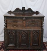 A 19th century continental carved oak si