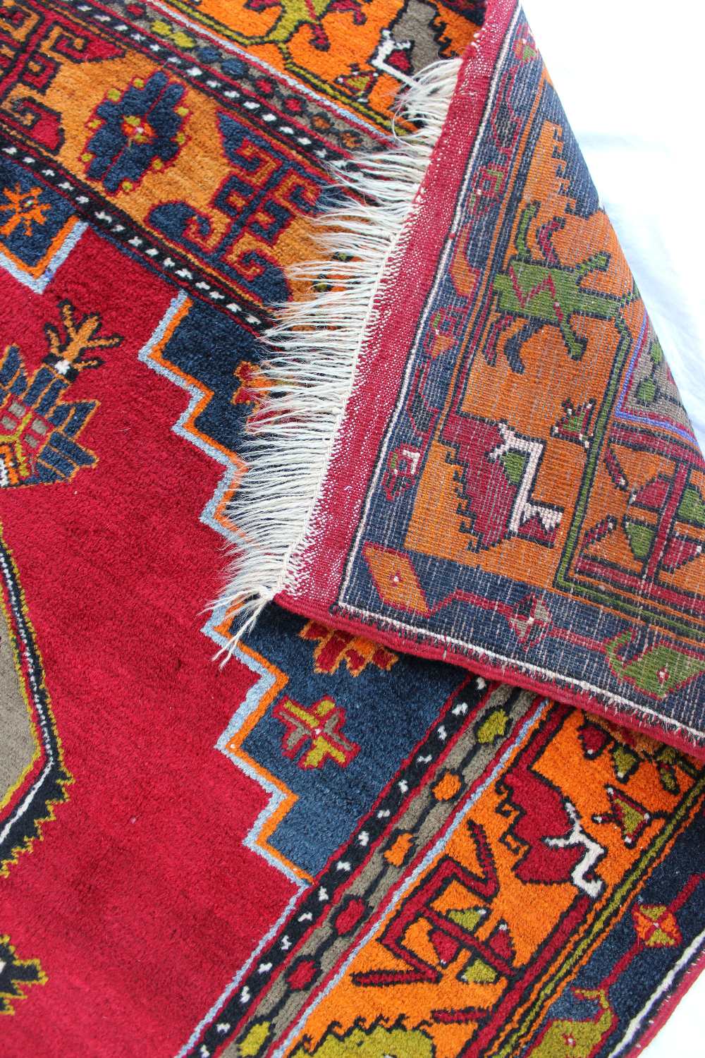 A red ground rug with a central medallio - Image 3 of 3