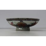 A Chinese porcelain shallow bowl, decorated to the outside edge with underglaze blue leaves and