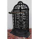 A cast iron stick stand, with pierced fl