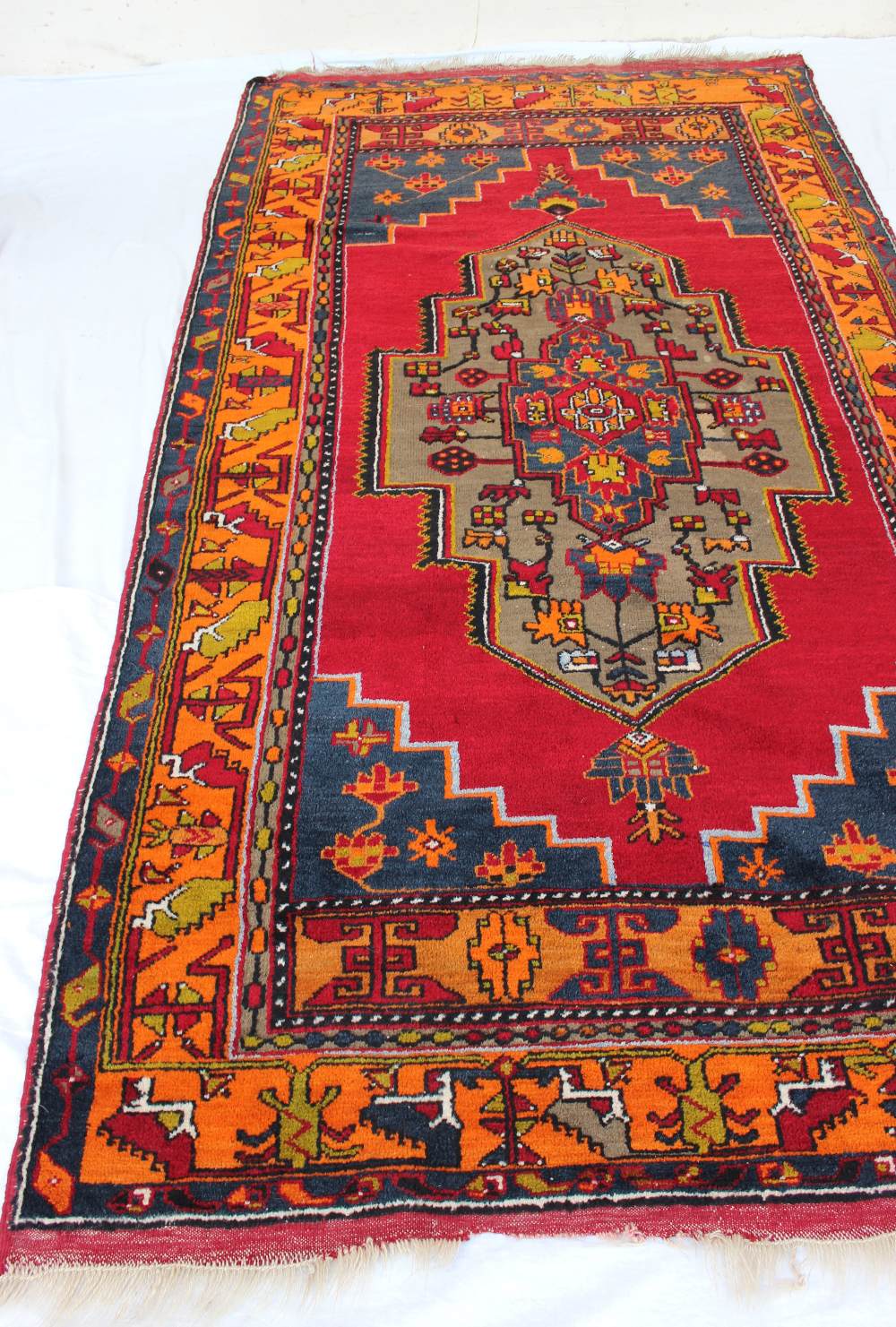 A red ground rug with a central medallio - Image 2 of 3