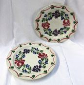 A pair of Dillwyn Persian rose pattern plates, impressed mark, 27cm diameter