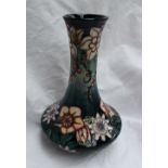 A modern Moorcroft carousel pattern vase with a tapering neck and squat body, impressed mark, signed