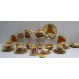 A Clarice Cliff matched crocus pattern part tea and dessert set comprising a teapot and stand, three