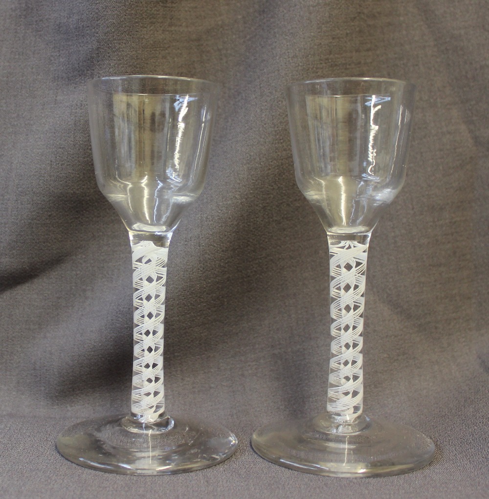 A pair of 18th century cordial glasses with double helix cotton twist stems on a spreading foot, - Image 2 of 3