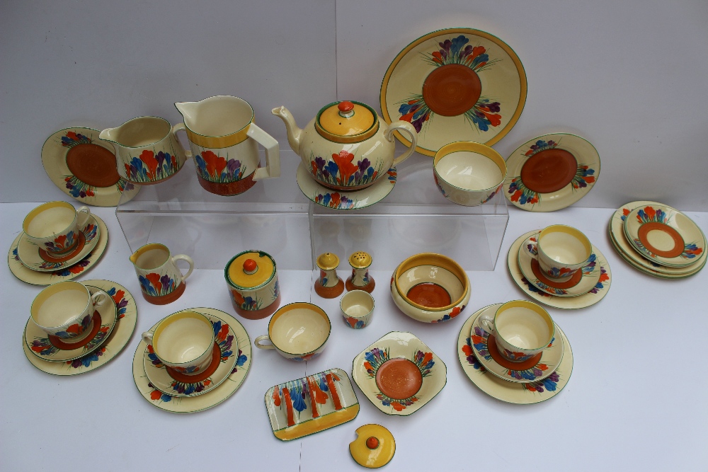 A Clarice Cliff matched crocus pattern part tea and dessert set comprising a teapot and stand, three - Image 2 of 6