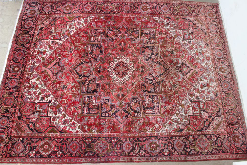 A large red ground rug with a small cent