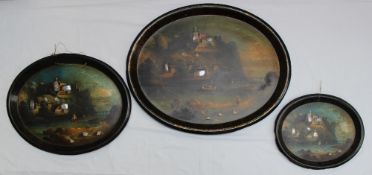 A set of three oval black lacquer papier