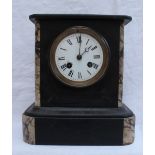 A Black slate clock, of rectangular form with veined marble pillasters, the enamel dial with Roman