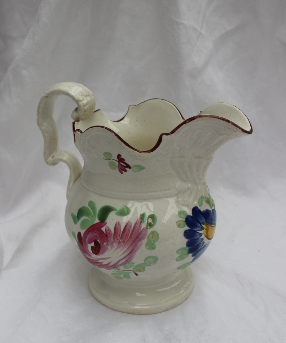 A 19th century pottery jug painted with - Image 2 of 5