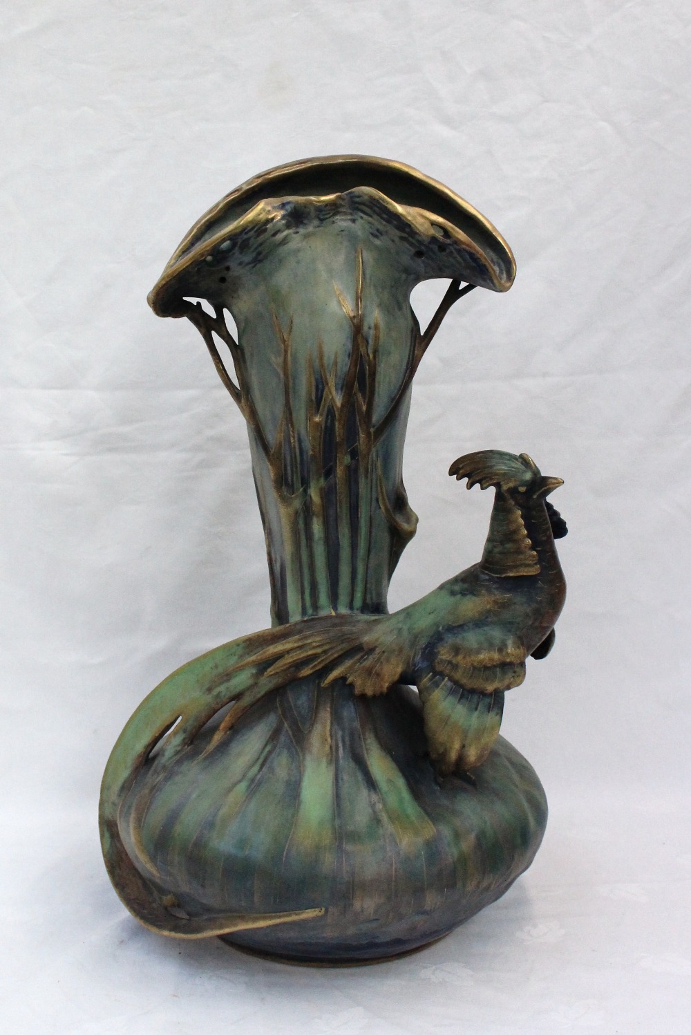 An Amphora pottery vase of naturalistic form modelled with a pheasant to a design by Edward