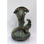 An Amphora pottery vase of naturalistic form modelled with a pheasant to a design by Edward