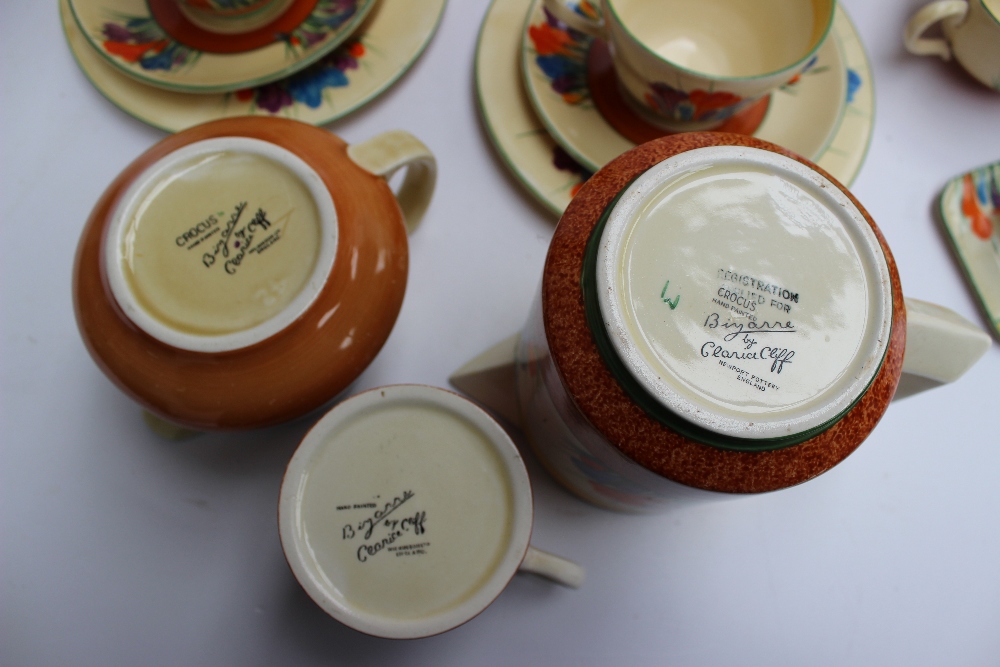 A Clarice Cliff matched crocus pattern part tea and dessert set comprising a teapot and stand, three - Image 3 of 6