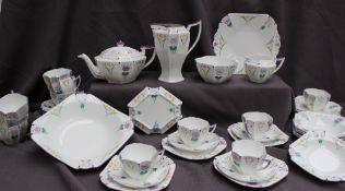 A Shelley part tea set decorated with garden flowers, including a large bowl, plate, teapot,