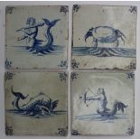 A set of four Delft tiles, decorated wit
