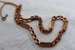 A 9ct yellow gold watch chain, with text