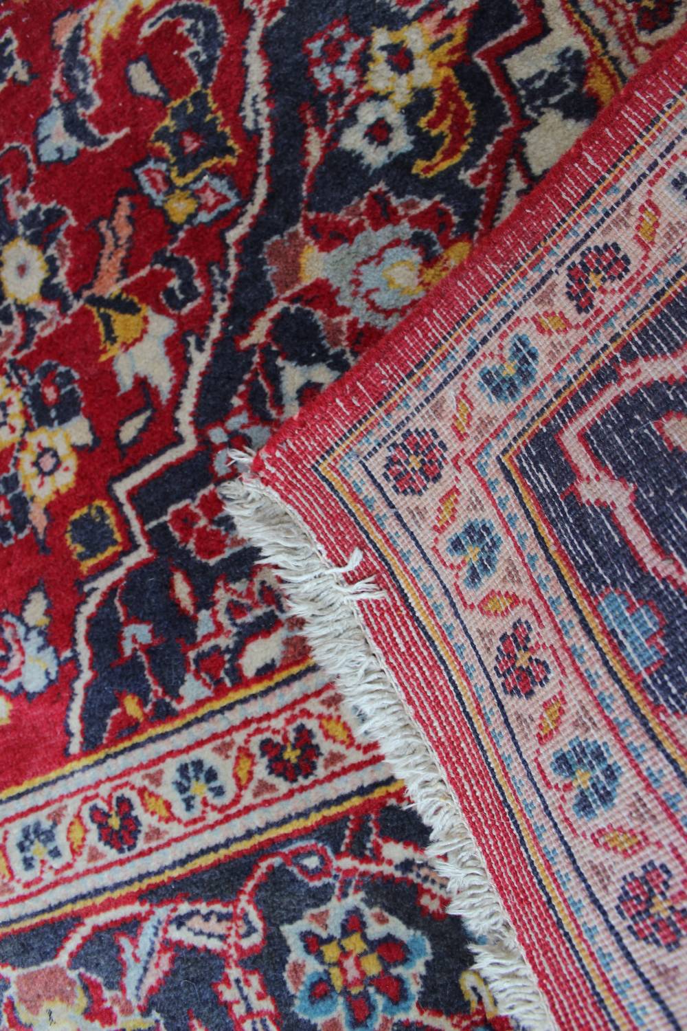 A red ground rug with a central medallio - Image 3 of 3