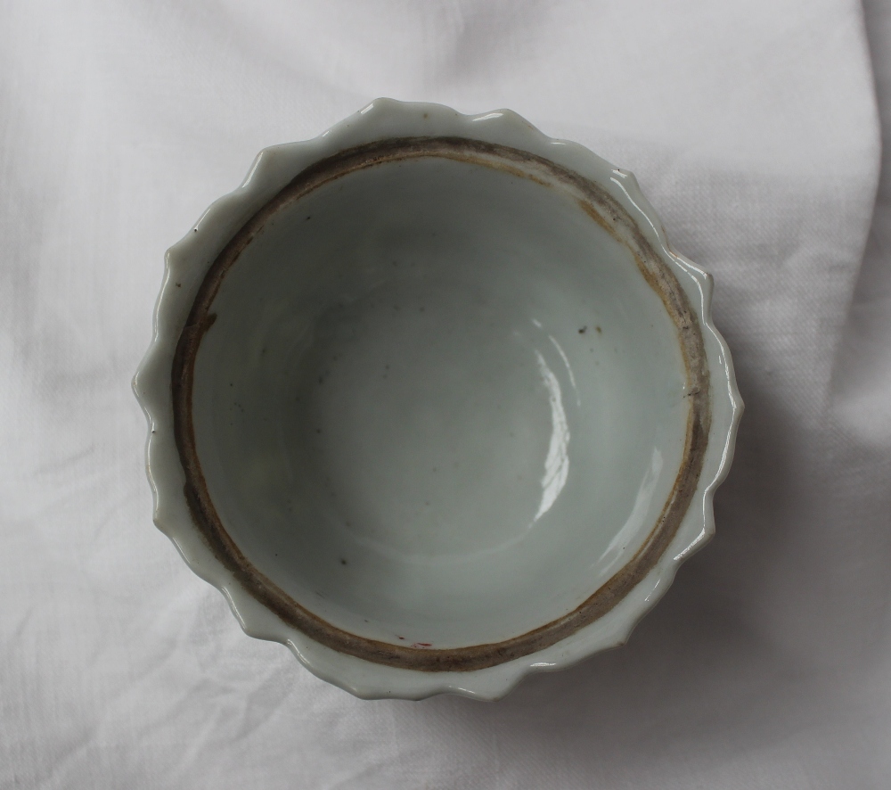 A 19th century Chinese porcelain bowl with a scalloped edge with ogee panels, sprays of garden - Image 4 of 6