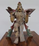 A large carved softwood figure of Garuda, with gesso and painted decoration, 92cm high