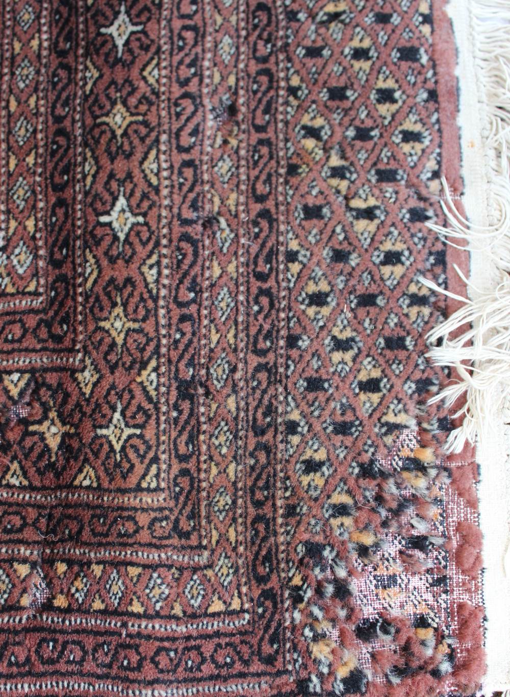 A red ground rug with a central geometri - Image 6 of 6