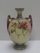A Royal Worcester Prismatic enamels porcelain twin handled vase, transfer and infil decorated with