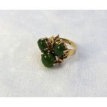 A Jade and yellow metal dress ring set w