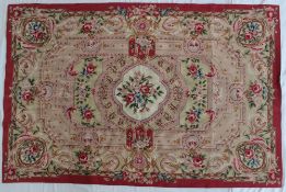 An Aubusson tapestry style rug decorated