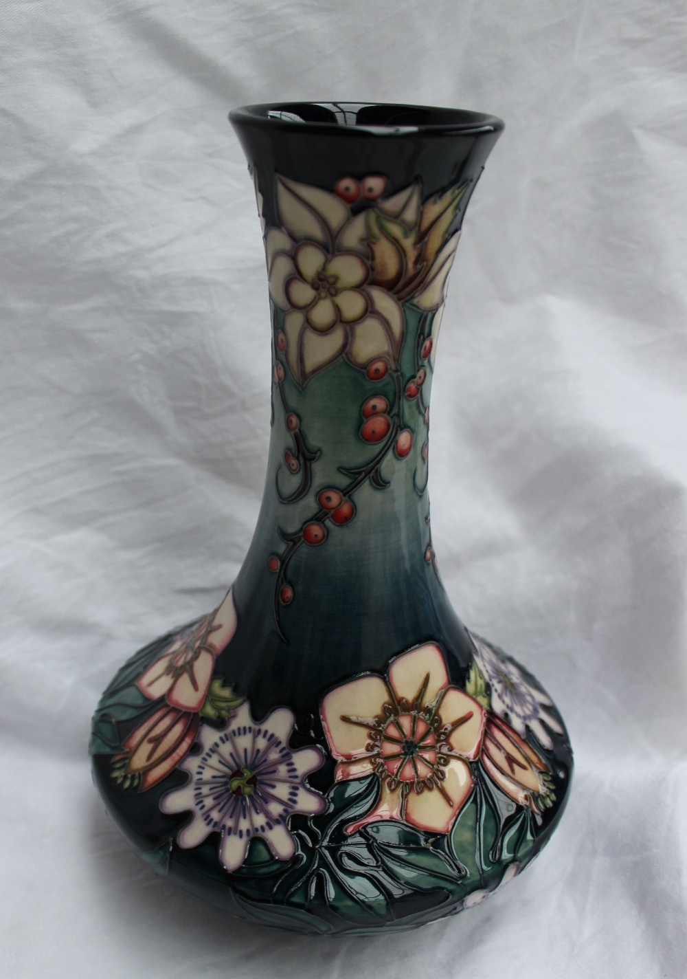 A modern Moorcroft carousel pattern vase with a tapering neck and squat body, impressed mark, signed - Image 2 of 3