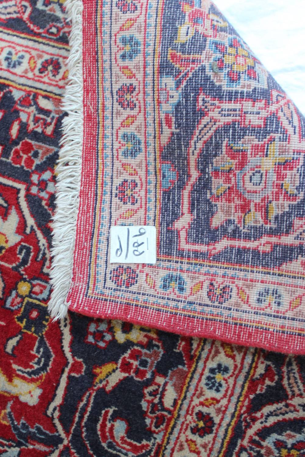 A red ground rug with a central medallio - Image 2 of 3