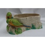 A Clarice Cliff Budgerigar vase, of oval form with two budgerigars on a rocky base, 28cm long