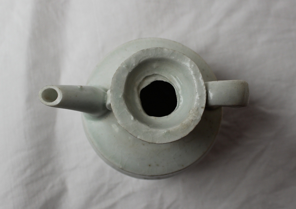 A 19th century Chinese porcelain white glazed jug with a tapering neck, ribbed body and spreading - Image 2 of 5