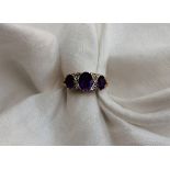 An Amethyst and diamond ring, set with t