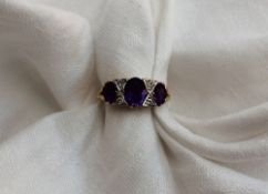 An Amethyst and diamond ring, set with t
