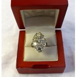 A diamond cluster ring, set with fifteen brilliant cut diamonds totalling approximately 4cts, to a
