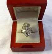 A diamond cluster ring, set with fifteen brilliant cut diamonds totalling approximately 4cts, to a