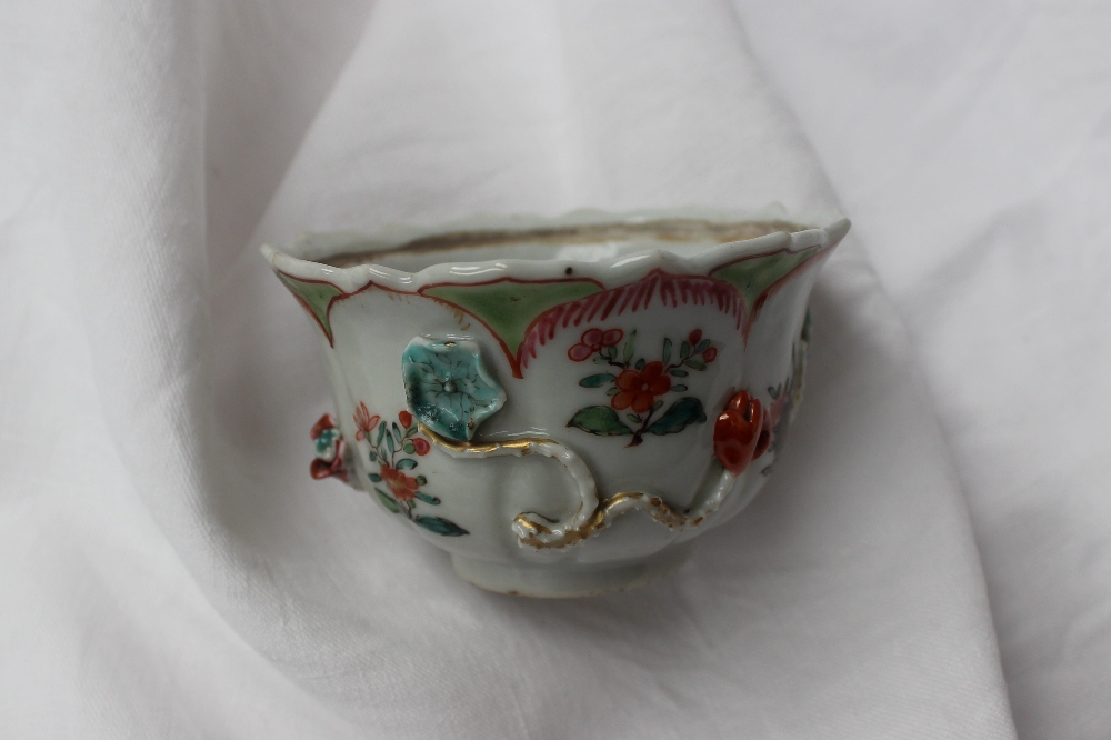 A 19th century Chinese porcelain bowl with a scalloped edge with ogee panels, sprays of garden - Image 3 of 6