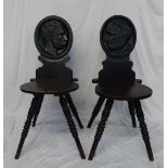 A pair of 19th century oak hall chairs, the oval backs carved with side on portraits titled "Humbert