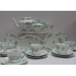 A Shelley part tea set decorated in the Blue Rock pattern No.13591, including a teapot, oval dish,
