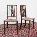 A pair of 19th century beech bedroom chairs with wheelback splats and rush seats on tapering legs,