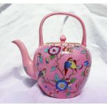 A Victorian Beech Hancock & Co teapot with a looped handle over the circular finial topped cover and