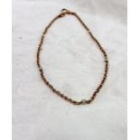 A 9ct yellow gold and seed pearl set chain, approximately 11.