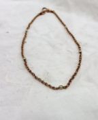 A 9ct yellow gold and seed pearl set chain, approximately 11.