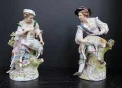 A pair of Sitzendorf porcelain figures of a Shepherd and a Shepherdess on naturalistic circular