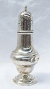 An Edward VII silver sugar caster of baluster form with a flame finial and pierced domed lid on a
