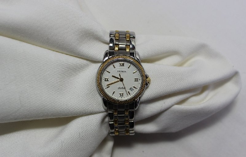 A ladies steel and yellow metal Tissot Ballade wristwatch with a white dial,
