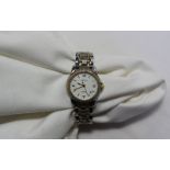 A ladies steel and yellow metal Tissot Ballade wristwatch with a white dial,