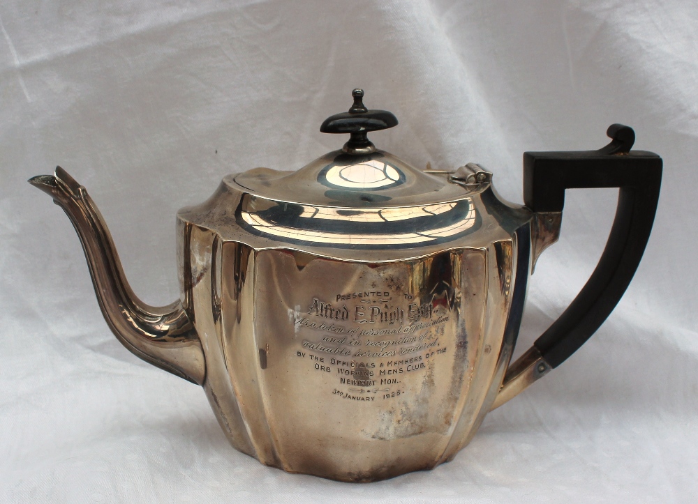 A George V silver four piece tea set of panelled form, comprising a hot water jug, teapot, - Image 2 of 3