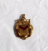 A 9ct yellow gold pendant bearing the enamel Coat of arms of the County Borough of Newport,