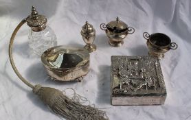 A late Victorian silver box and cover, embossed with figures seated in a garden playing draughts,