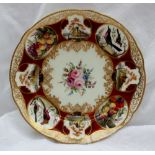 A Nantgarw porcelain plate painted with vignettes of birds, castles and fruit to a red ground, the